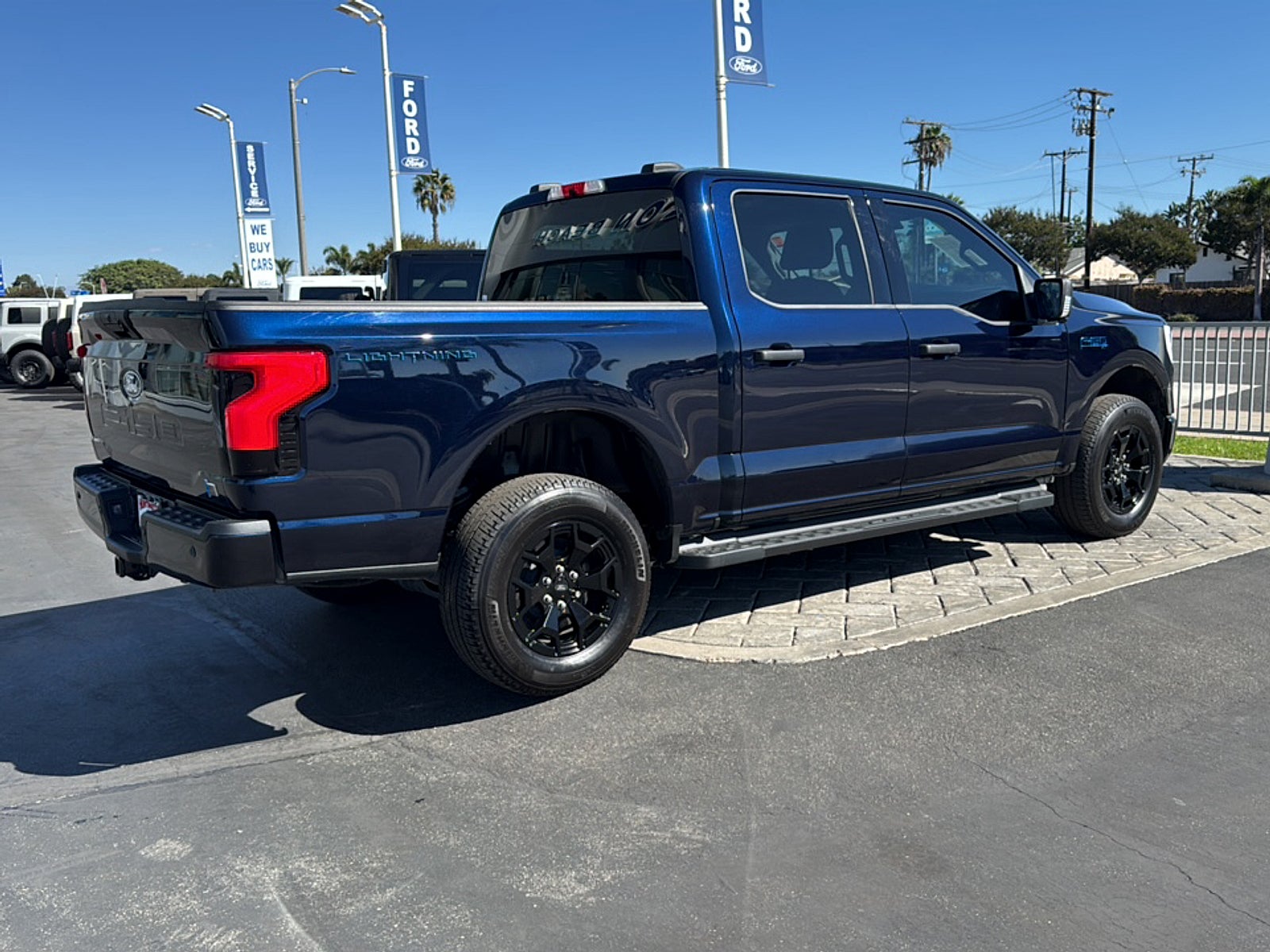 Used 2025 Ford F-150 Lightning XLT with VIN 1FTVW3LK8SWG04737 for sale in Huntington Beach, CA