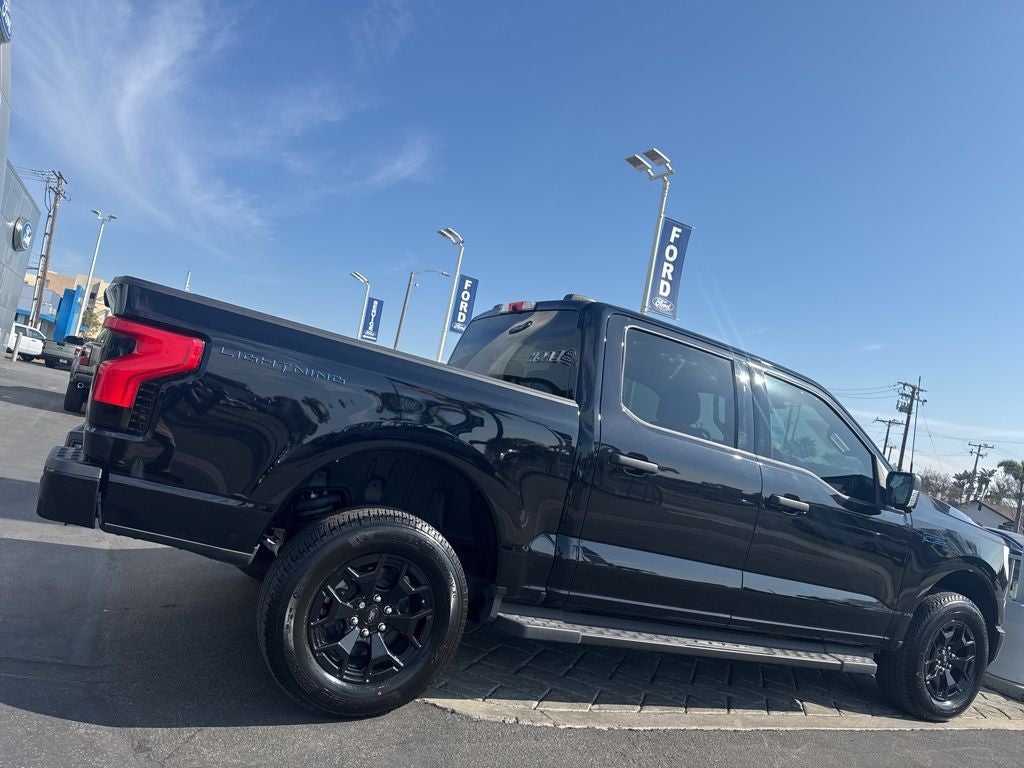 Used 2025 Ford F-150 Lightning XLT with VIN 1FTVW3LK8SWG21392 for sale in Huntington Beach, CA