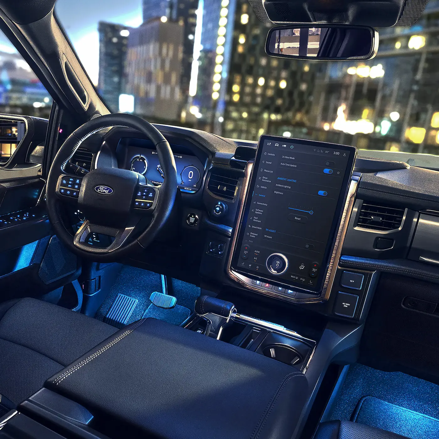 The interior of a Ford F-150 Lightning pickup truck at night. The dashboard features a large vertical touchscreen display showing vehicle controls. The steering wheel and instrument cluster are visible. In the background, through the windshield, are the blurry lights of a city skyline.